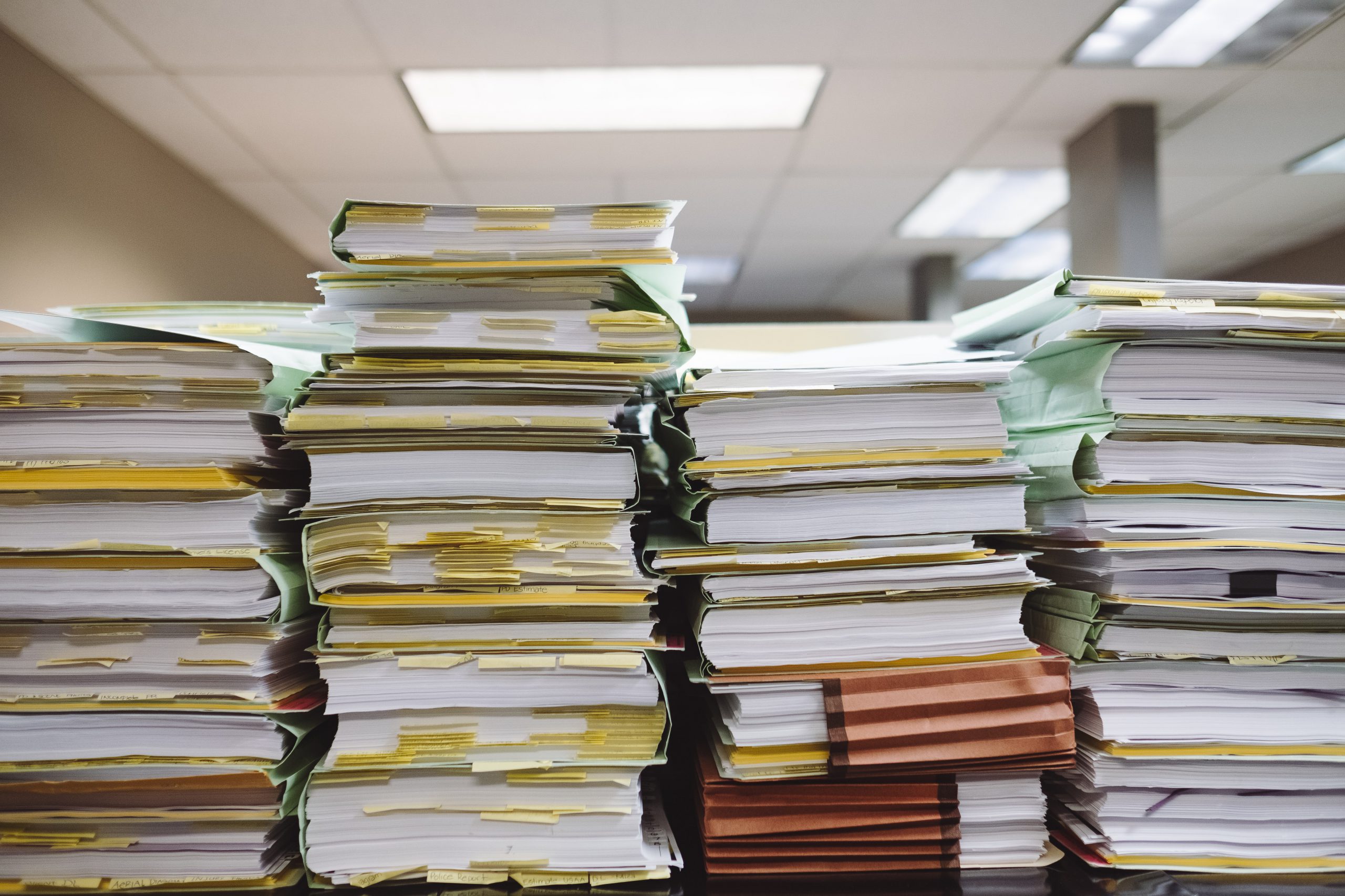 pile of files and books representing files